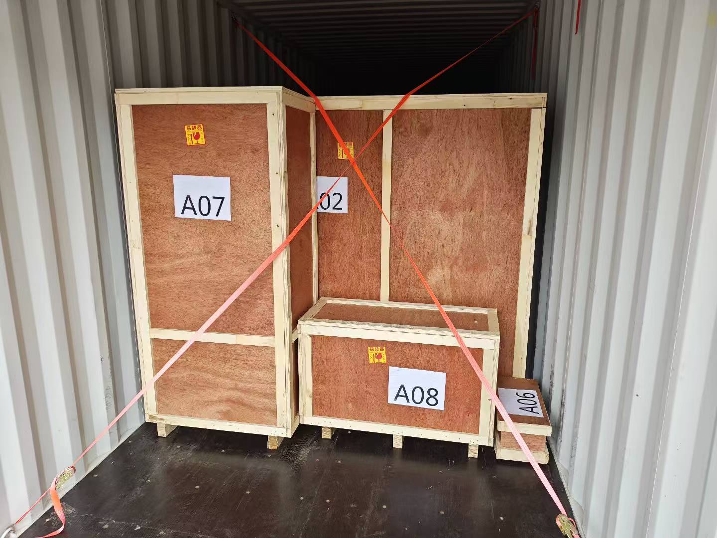 Export crates positioned for food machinery container loading